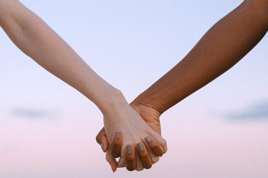 photo of people holding hands